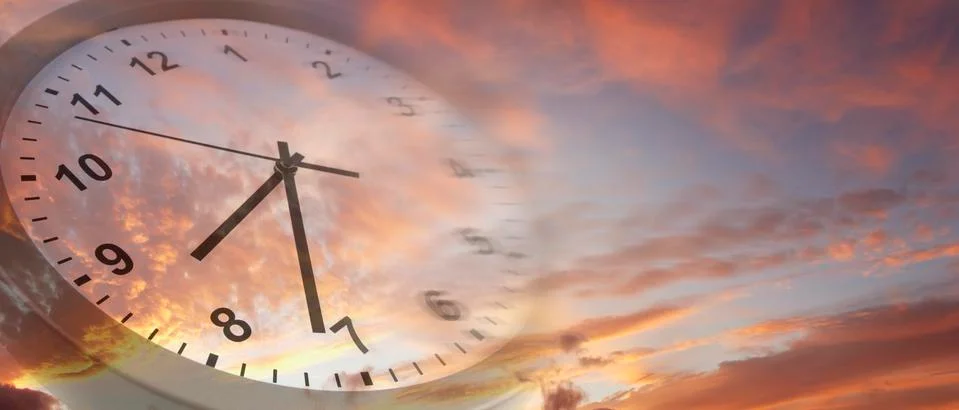 Clock face in bright sky Stock Photos