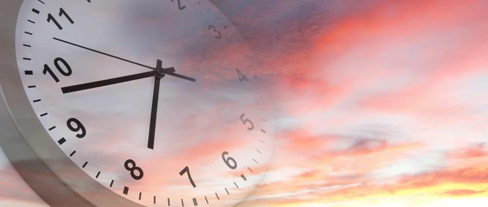 Clock face in bright sky. Time passing Stock Photos