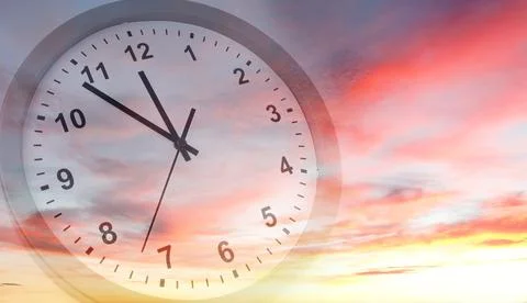 Clock face in bright sky. Time passing Stock Photos