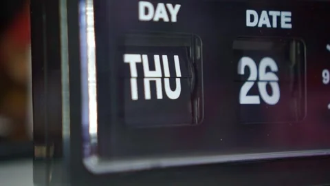 Clock face flipping day date numbers, dark ambiance, time change and daily Stock Footage 344012129