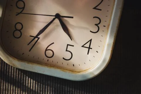 Clock face with focus on center and spot light accent. Time concept Stock Photos