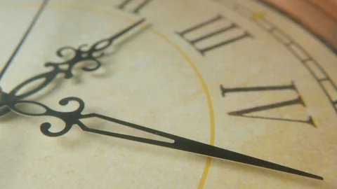 Clock face with Latin numbers and arrows pointing twenty-five minutes past two Stock Footage 115435780