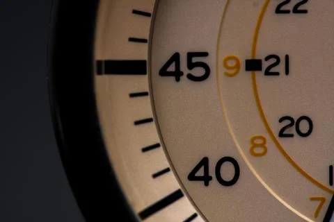 The clock face, in the middle of the dial. Modern aluminum and bronze watch t Stock Photos