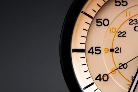 The clock face, in the middle of the dial. Modern aluminum and bronze watch t Stock Photos