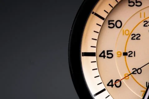 The clock face, in the middle of the dial. Modern aluminum and bronze watch t Stock Photos