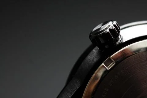 The clock face, in the middle of the dial. Modern aluminum and bronze watch t Stock Photos