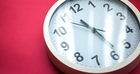 Clock face time lapse on red background with copy space for your own text Stock Footage 156906720