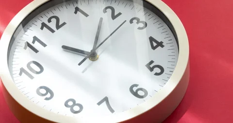 Clock face time lapse on red background with copy space for your own text Stock Footage 157133838