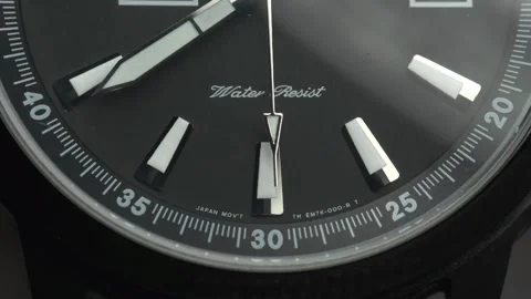 Clock face with water resistant sign and second hand movement, macro Video stock 144023387