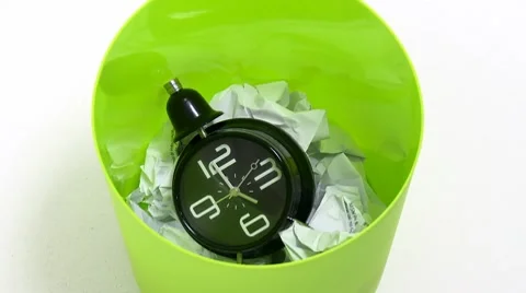 Clock falls inside trash can 02 Video stock 10127997