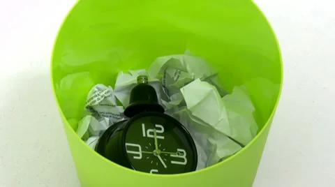 Clock falls inside trash can 04 Video stock 10131476