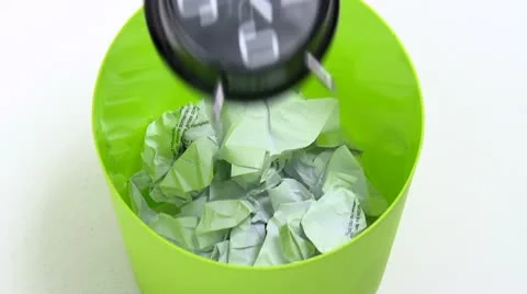 Clock falls in trash can 1 Video stock 10124408