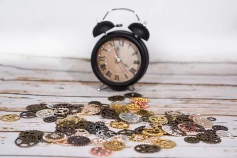 Clock gear wheels on table. Retro clock repairing abstract photo Stock Photos