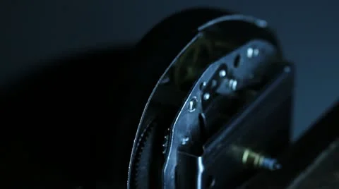 Clock gears close up with light flashes Stock Footage 12321553