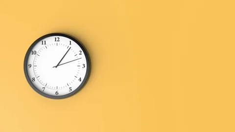 The clock is going very fast. A wall clock on a yellow background Stock Footage 129456437