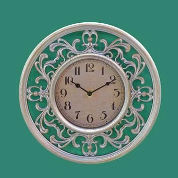 Clock at green wall Stock Photos