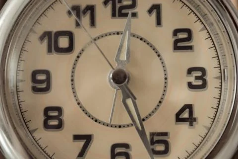 The clock is half past twelve. Stock Photos