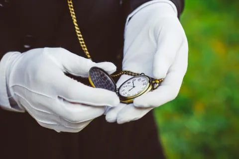 Clock in hand antique Stock Photos