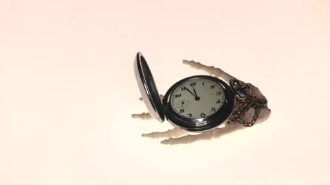 The clock in the hand of the skeleton The apocalypse is coming. Stock Footage 136469848