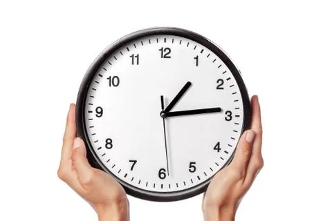 Clock in hands isolated on white. creative photo. Stock Photos
