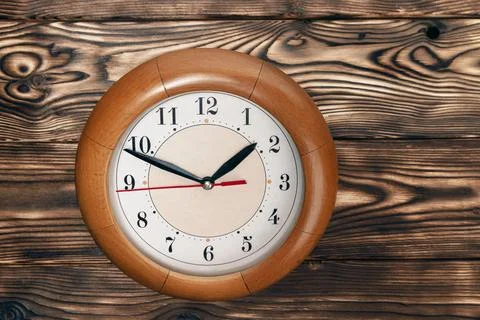 A clock with hands showing the time of 1 hour and 50 minutes. round clock Stock Photos