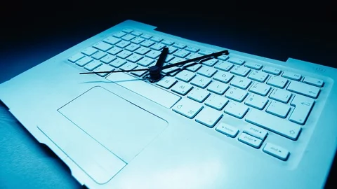 Clock hands turn swiftly in time lapse on a computer keyboard. Abstract, Stock Footage 115699718