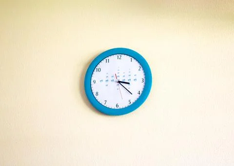 Clock hanging on the wall Stock Photos