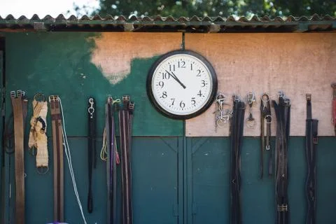 Clock hanging on wall Stock Photos