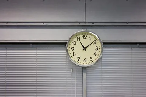 Clock hanging on the wall Foto stock