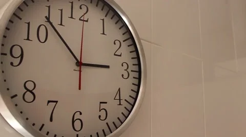 The clock hangs on the wall Stock Footage 65302334