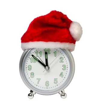 Clock in the hat of santa Stock Photos