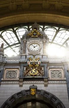 Clock inside of Antwerp Central Station Фото