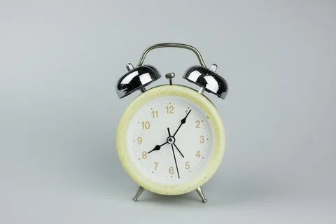 Clock isolated on gray background Stock Photos