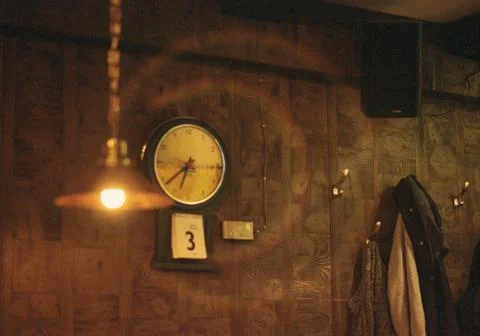 Clock, lamp and jacket Stock Photos