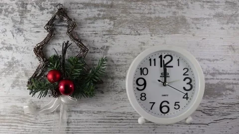 Clock on a light wooden background. The second hand on the watch. Stock Footage 163970932