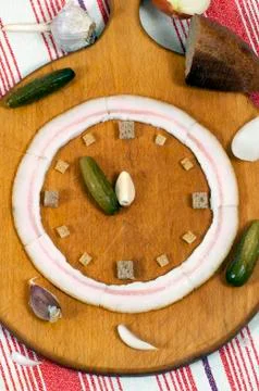 Clock made of food Stock Photos