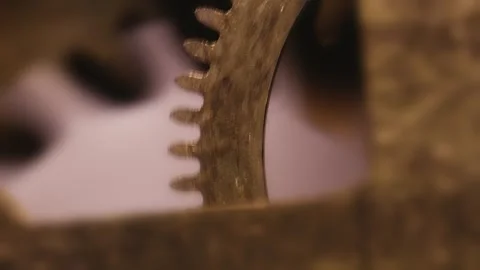 Clock movements delicate gear cog mechanism rotating in perfect timing Stock Footage 313656114