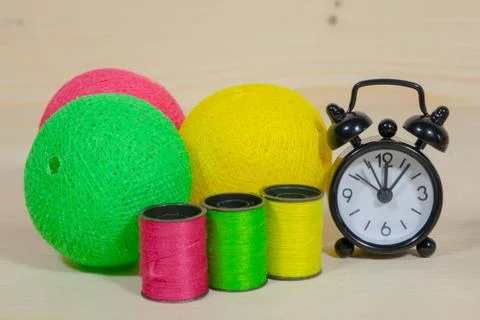 Clock, multi-colored yarn Stock Photos