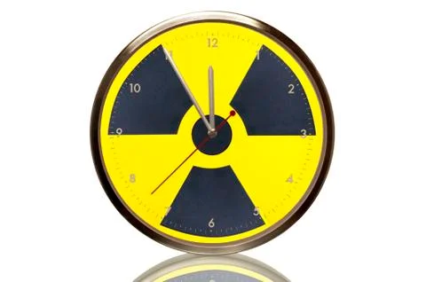 Clock with the nuclear symbol, 5 minutes to twelve, eleventh hour, symbolic i Stock Photos