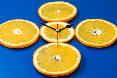 Clock of orange slices Stock Photos