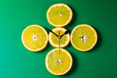 Clock of orange slices, top view Stock Photos