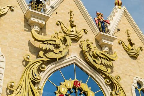 Clock on the ornamented building facade Stock Photos