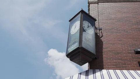 A Clock Outside A Bank In A Small Town Stock Footage 87399673