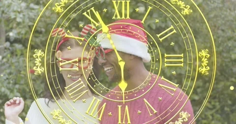 Clock overlay advancing toward midnight urging couple adjusting glasses laughing Stock Footage 319678558
