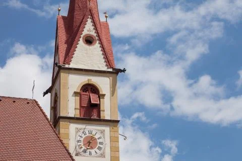The clock painted outside the bell tower of the church in Selva di Val Garden Stock Photos