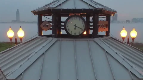 Clock on a pavillion, cam moves down to see water through pav., Baton Rouge, LA, Stock Footage 53366387