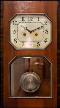 Clock with pendulum Stock Photos