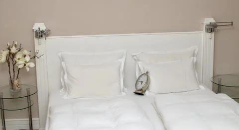 Clock on Pillows Stock Photos