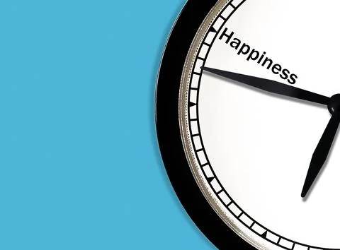 Clock pointer on happiness text with blue copy space background Photos