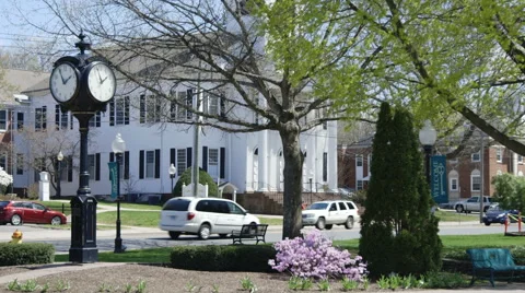 Clock post and spring foliage in Southington Stock Footage 49937366